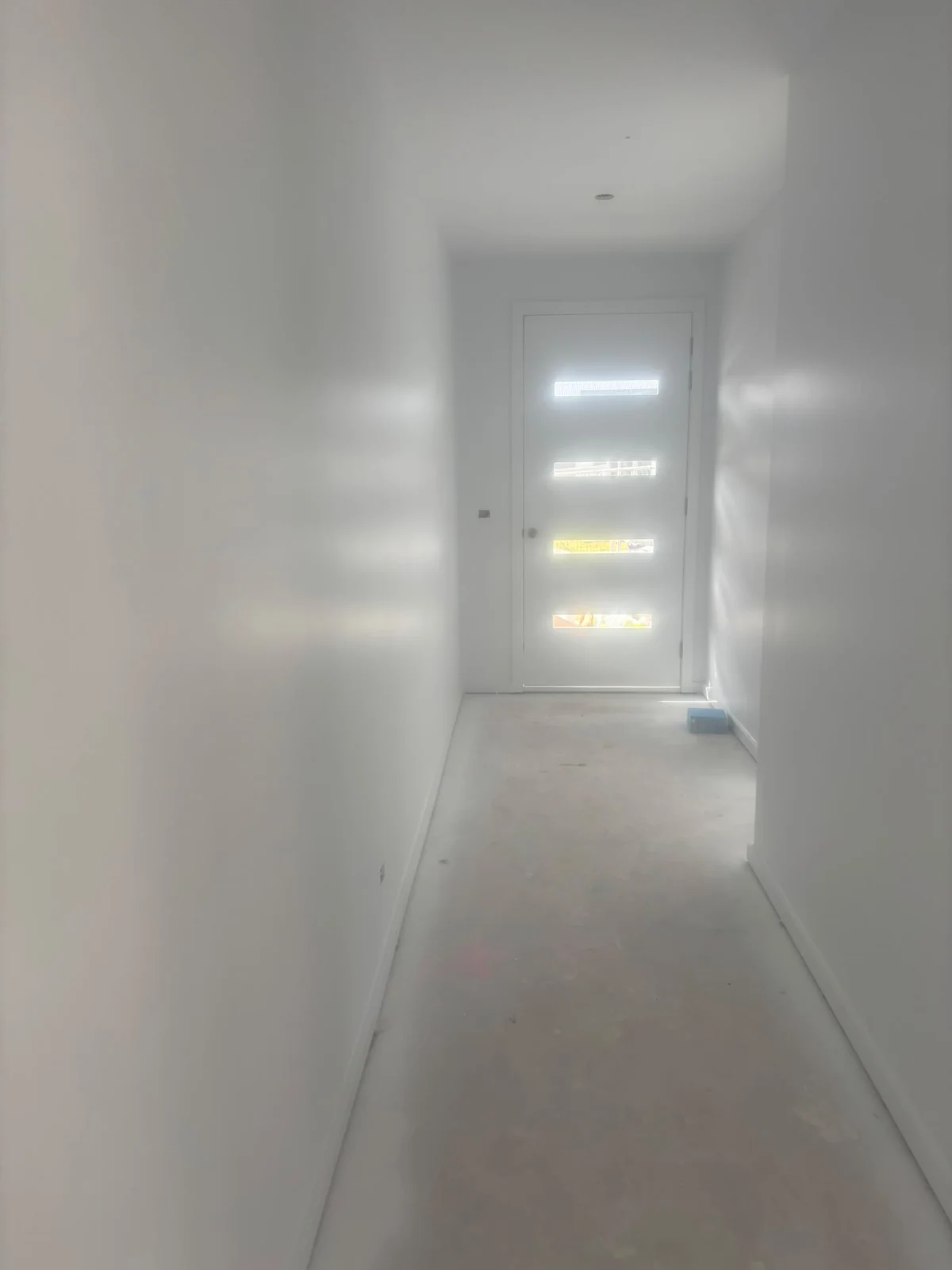 Light painted hallway with protected flooring