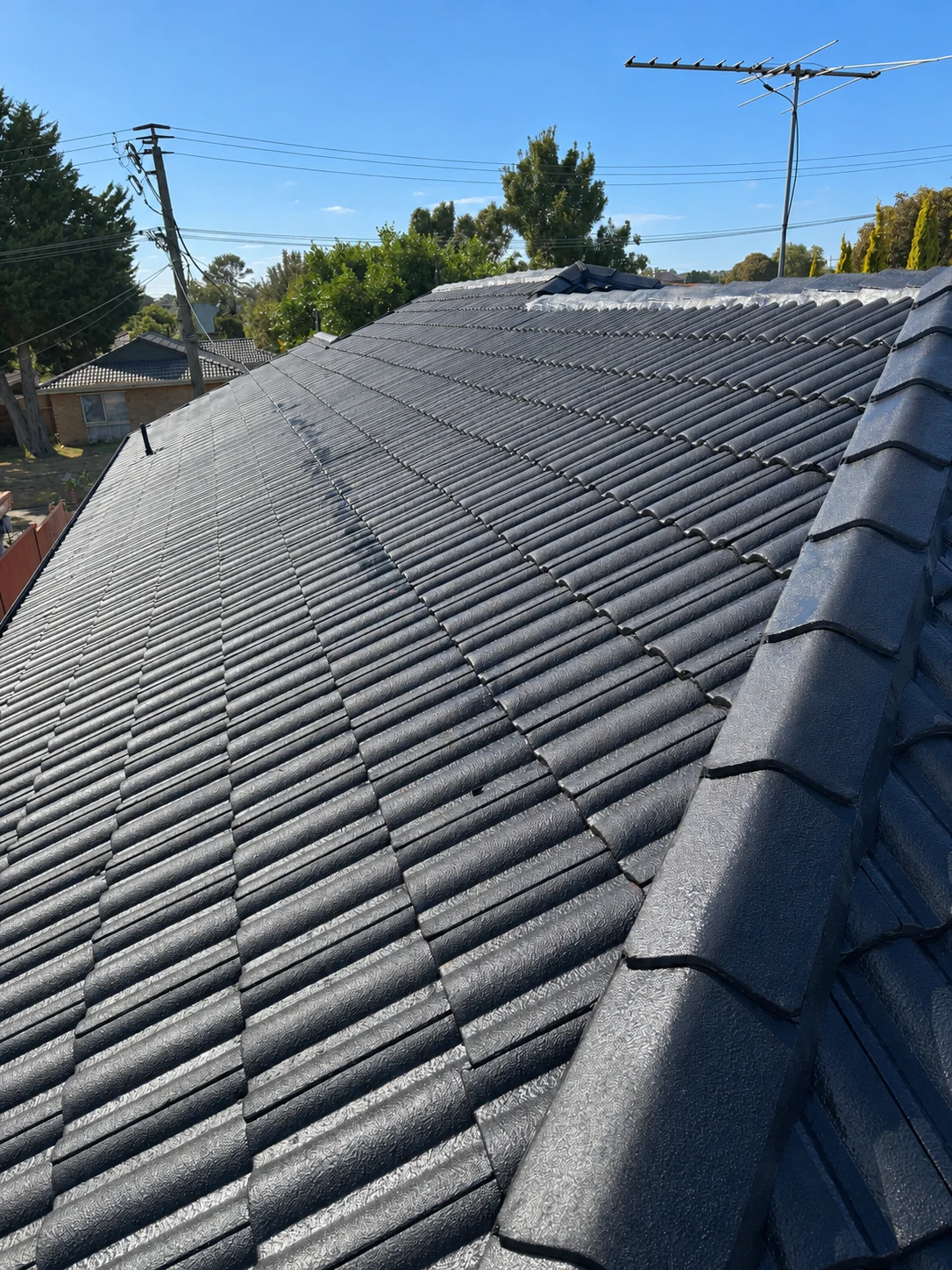 Dark tiled roof photographed in daylight